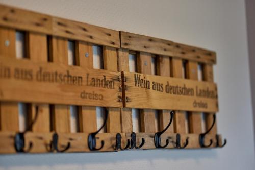 a bunch of wooden pallets hanging on a wall at Moselhotel Weinhaus Simon `Sauna`Restaurant`ELadesäule in Wintrich