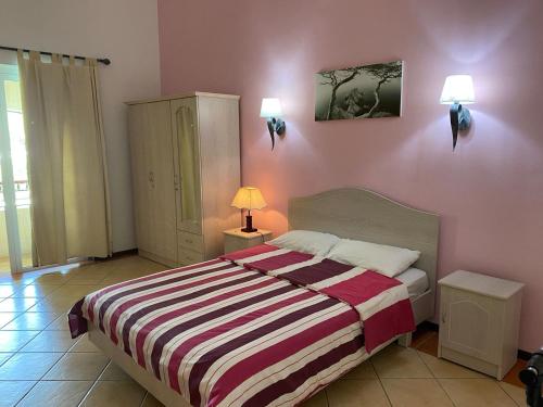 Кровать или кровати в номере Best Holiday Beach Apartment