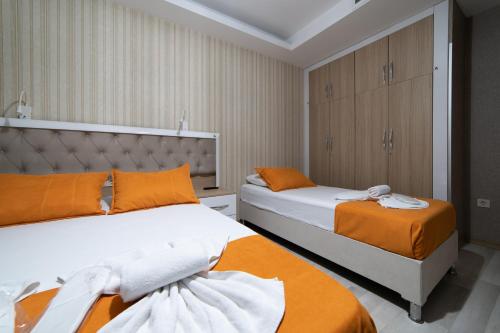 Postel nebo postele na pokoji v ubytování Mardy Suit Hotel