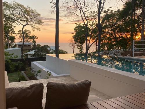 a view of the ocean from a house at Villa Laia - Santa Teresa in Santa Teresa Beach