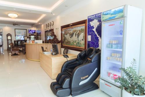 a store with a salon with a reclining chair in a room at Luxury Airport Hotel & Travel in Noi Bai