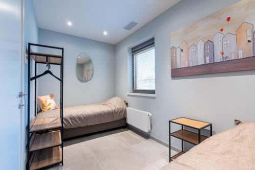 Postel nebo postele na pokoji v ubytování Vakantiewoning De Bles