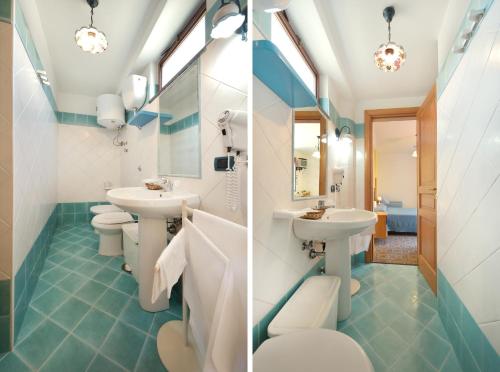 a bathroom with two sinks and two toilets at La Capannina in Procida