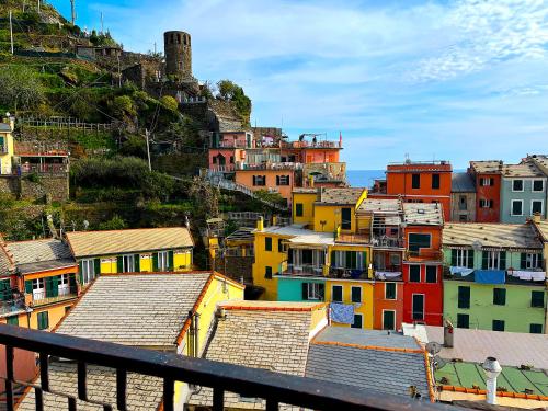 a view of a city with houses on a hill at Pellegrino Rooms in Vernazza