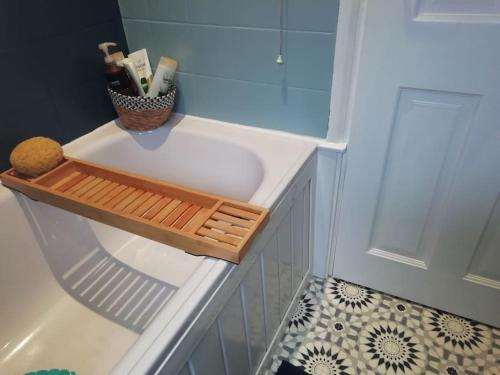 a bathroom with a white sink in a shower at Beechwood in Bangor