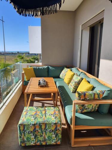 a living room with a couch and a table at HEAVEN BEACH in Sidi Rahal