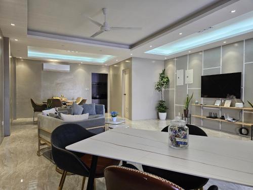 a living room with a table and a couch at Spacious 5-bedroom, 4-bath townhouse in Legazpi City in Legazpi