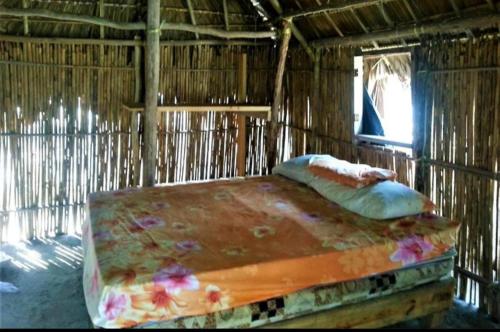 Postel nebo postele na pokoji v ubytování Islas de San blas cabaña tradicional Guna