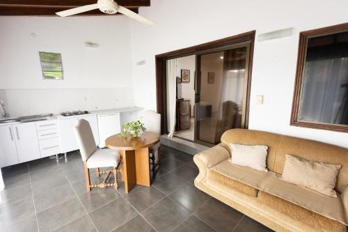 a living room with a couch and a table at Terrazas Vista Verde in Asuncion