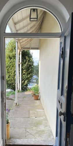 an entrance to a house with an open door at Luxury flat in Totnes in Totnes