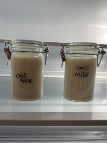 two jars of candles sitting on top of a counter at Luxury flat in Totnes in Totnes