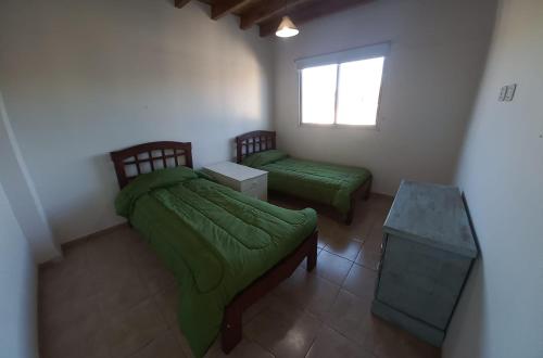 Voodi või voodid majutusasutuse Mendoza Fundacional toas