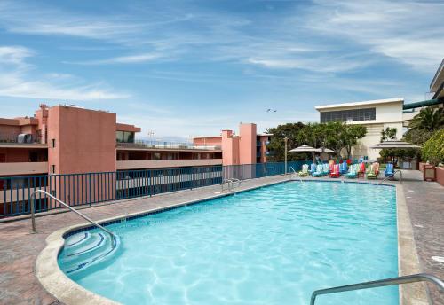 a large swimming pool on top of a building at La Jolla Cove Suites in San Diego