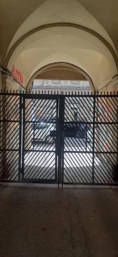 an open gate in a tunnel with a bus at Центрові апартаменти in Ivano-Frankivsʼk