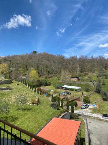 a view from the balcony of a house with a park at CASA DELLA PIAZZA in Bagnone