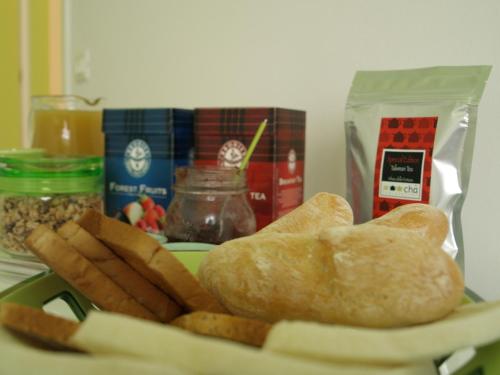a plate of bread and other food on a table at B&B Linea Verde in Milan