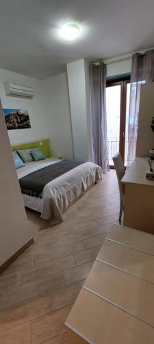 Postel nebo postele na pokoji v ubytování B&B New Acropolis