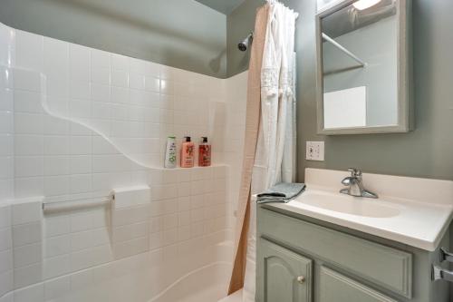 a white bathroom with a sink and a shower at Pet-Friendly Torrington Vacation Rental Near River in Torrington