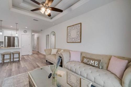 a living room with a couch and a ceiling fan at South West Florida Family Home, 3 Bedroom,2 Bathroom, King bed suite, Close to Beaches, Parks, Fishing, Golfing, Kayaking in Rotunda-West