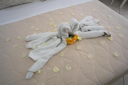 a bed with two towel animals on it at B&B Il Gabbiano in Porto Cesareo