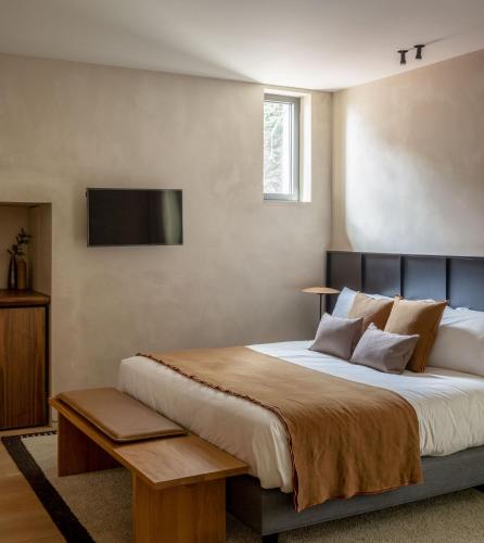 Ένα ή περισσότερα κρεβάτια σε δωμάτιο στο Hotel Ur Bare