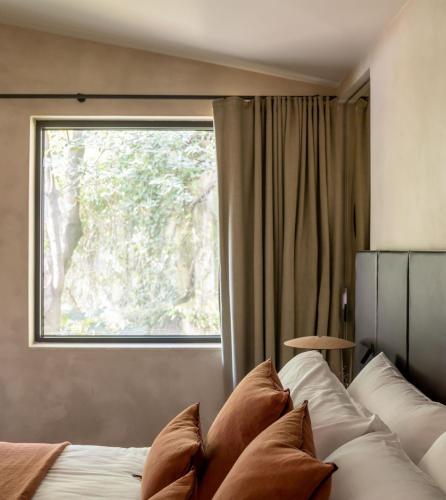 Ένα ή περισσότερα κρεβάτια σε δωμάτιο στο Hotel Ur Bare