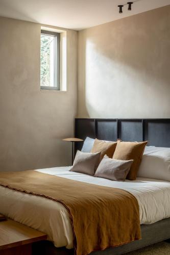 Ένα ή περισσότερα κρεβάτια σε δωμάτιο στο Hotel Ur Bare