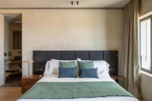 Ένα ή περισσότερα κρεβάτια σε δωμάτιο στο Hotel Ur Bare