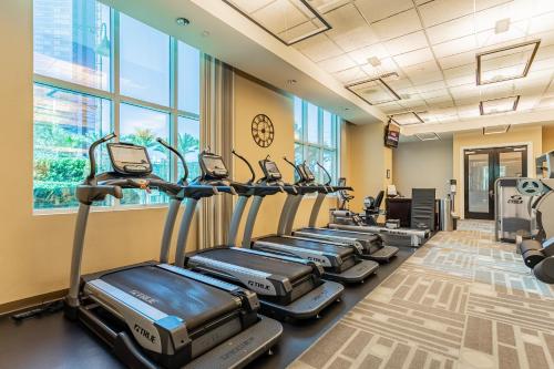 a row of treadmills in a gym with windows at MGM Signature, Centrally Located, Strip Views NO RESORT FEE in Las Vegas