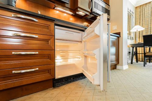 an empty refrigerator with its door open in a kitchen at MGM Signature, Centrally Located, Strip Views NO RESORT FEE in Las Vegas
