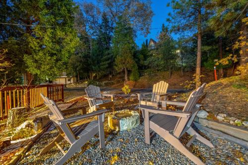 a group of chairs sitting on a patio at Hot Tub-EV-AC-Kid Friendly-Arcade Game-Lake Access in Lake Arrowhead