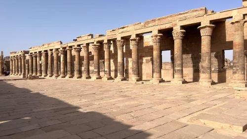 a long row of columns on the side of a building at Royal Mountain in Luxor