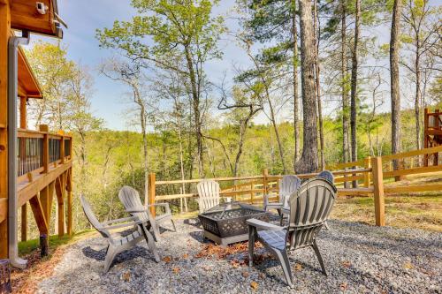 a group of chairs sitting around a fire pit at Mountain View and Fire Pit Updated Murphy Cabin! in Murphy