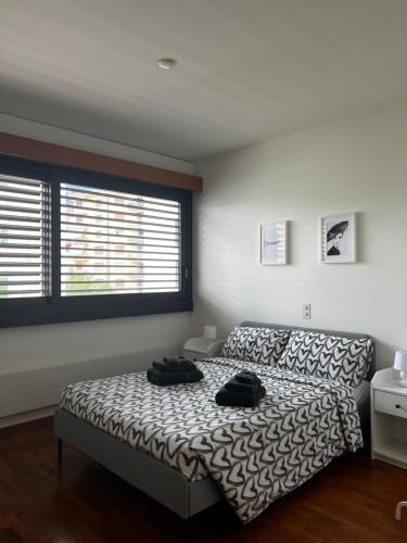 Postel nebo postele na pokoji v ubytování Lugano City Apartment