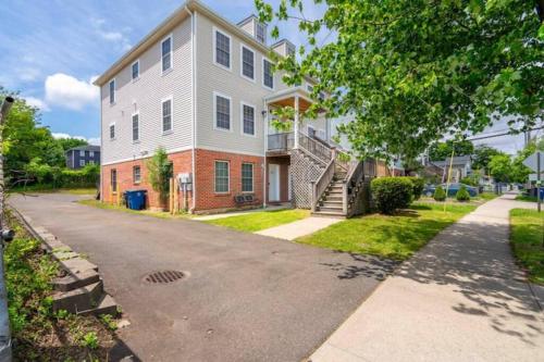 a large house with a driveway in front of it at Gorgeous Waterfront 3 Bedroom, 1.5 Bathroom Unit. in New Haven