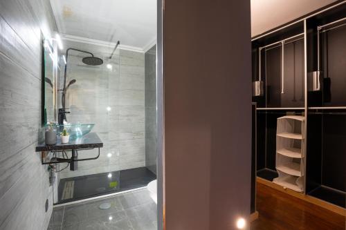 a bathroom with a sink and a toilet in a room at Charming Apt in Historic House in Coimbra