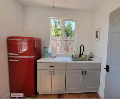 a kitchen with a red refrigerator and a sink at Private entry 2b1b guest suite in San Jose