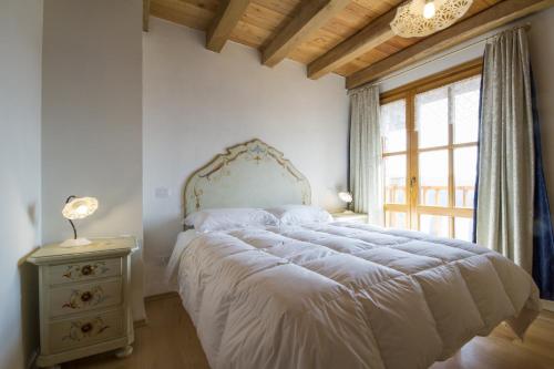 Giường trong phòng chung tại Casa Ursic Scrittore