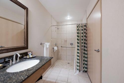 a bathroom with a sink and a shower at Best Western Plus Kentwood Lodge in Sun Valley