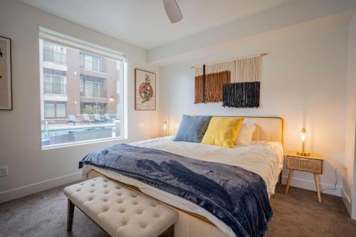 a bedroom with a large bed and a window at Charming Retreat in Heart of SLC in Salt Lake City