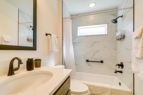 a bathroom with a sink and a toilet and a shower at Home with Lanai and Community Perks in The Villages! in Leesburg