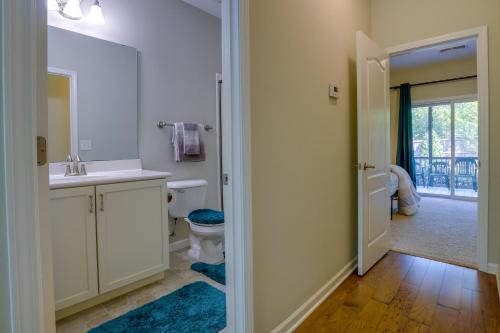 a bathroom with a sink and a toilet at Sunny Apex Vacation Rental with Pool Access! in Apex