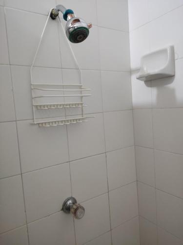 a shower with a shower head in a bathroom at Hosteria Puerta del Nus in Cisneros
