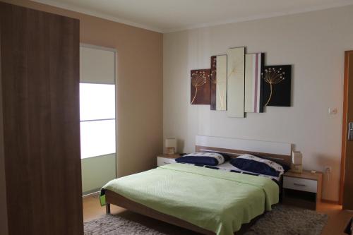 Postel nebo postele na pokoji v ubytování Apartments Roko Kolinda