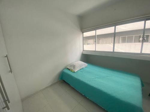 A bed or beds in a room at HABITACION CON BAÑO PRIVADO PARA 1 O 2 PERSONAS