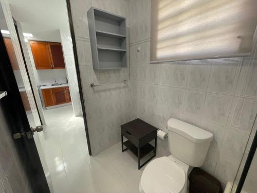 a small bathroom with a toilet and a sink at CasaMar House Whit Pool 3 Bedrooms 3 Bathrooms in San Juan
