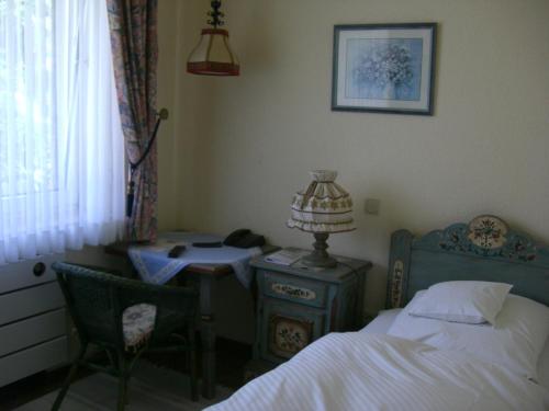 Ένα ή περισσότερα κρεβάτια σε δωμάτιο στο Hotel Haus Kirsch