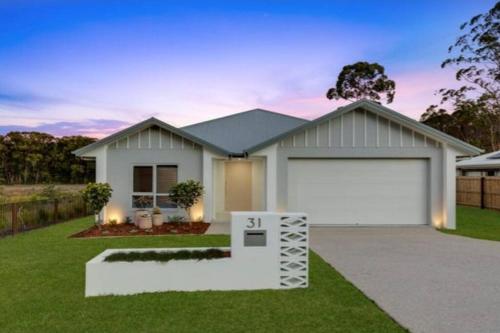 a rendering of a house with a garage at Unwind in Woombye in Woombye
