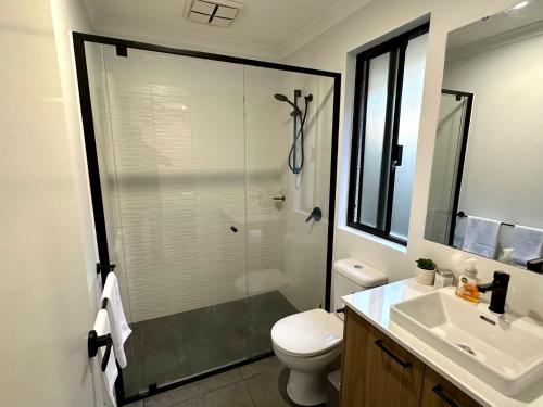 a bathroom with a shower and a toilet and a sink at Vasse Terrace in Vasse