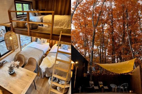a bedroom with two bunk beds and a tree mural at サウナ・ジャグジー・完全貸し切りという贅沢　大人の秘密基地　Tiny Cabin TATEGU#02 in Miyota